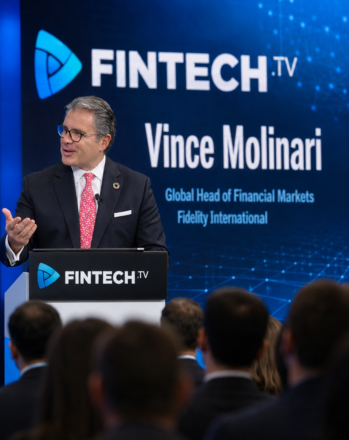 Vince Molinari speaking on stage at a global finance and fintech conference